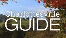 Charlottesville Guide logo in front of mountains and trees in the fall