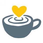 gray cup of coffee with a yellow heart in the foam on top