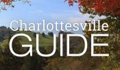 Charlottesville Guide logo in front of mountains and trees in the fall 