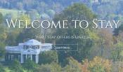 screen shot of website - picture of rotunda with welcome to stay in white text